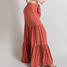 Our Taylor Tiered Pants will make you feel like a boho goddess! These comfy, flowy pants feature wide legs and tiers that flutter and dance as you move. Step out in style; you won't want to take them off!Model is 5'8" wearing a size small 100% rayon - Non-stretch fabric Chic Maxi Length Ruffled Skirt, Flowy Wide-leg Maxi Skirt For Day Out, Wide Leg Pants For Fall Vacation, Bohemian Non-stretch Maxi Skirt For Day Out, Bohemian Ruffled Maxi Skirt For Day Out, Bohemian Wide Leg Bottoms For Day Out, Bohemian Flare Bottoms For Fall, Bohemian Style Flare Bottoms For Fall, Casual Flowy Bottoms With Ruffles