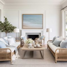 a living room filled with furniture and a fire place in front of a painting on the wall