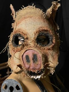 an animal mask with holes in it's face