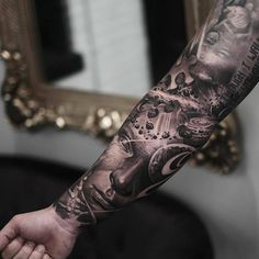 a man's arm with tattoos on it