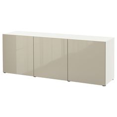 a white cabinet with three doors on the front and two drawers on the back side