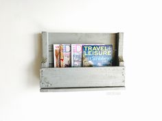 a wooden shelf with magazines on it