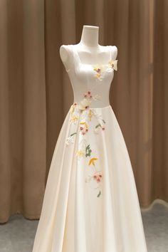 a white dress with flowers on it