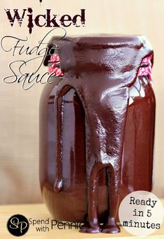 a jar filled with chocolate sitting on top of a table