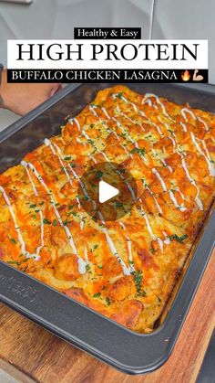 a person holding a tray with food on it and the words healthy & easy high protein buffalo chicken lasagna