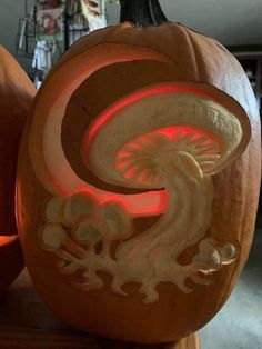 a carved pumpkin with an intricate design on it