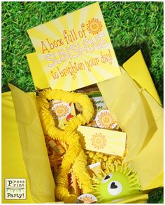 a yellow box filled with lots of sunshine items and a sign that says, i'm also full of sunshine to brighten you day