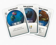 three card game cards showing different types of animals and fish in the ocean, with text reading alien beacon, ron asteroid, brita debus