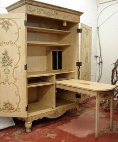 an old fashioned desk and hutch in a room with red carpeted flooring