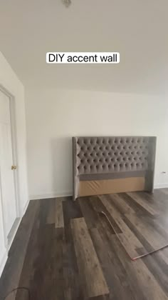 a bedroom with a bed, night stand and dresser in the corner next to it