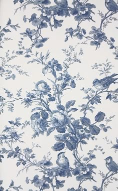 a blue and white floral wallpaper with birds on it