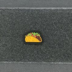 a close up of a taco sticker on the back of a car