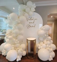 balloons are arranged on the floor in front of a sign that says victoria and david