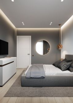 a bedroom with a bed, dresser and tv in it's center area that has four round mirrors on the wall