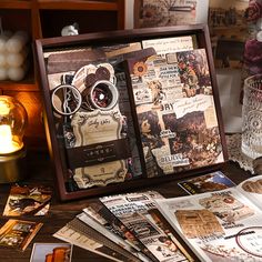 an assortment of items are displayed on a table in front of candles and other decorations