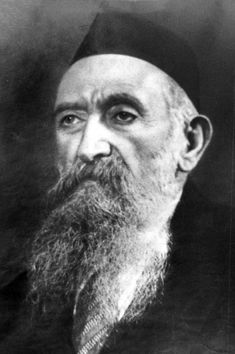 an old black and white photo of a man with a long beard