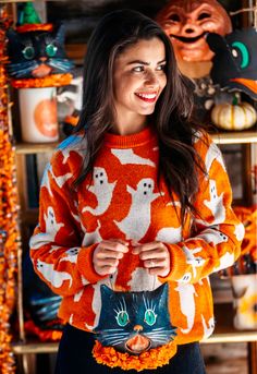 Step into a ghostly world of playful spookiness with our new Ghouls Gone Wild Sweater! An autumnal orange hue and a whimsical pattern of floating ghosts decorate this eerily playful sweater, made for a frightful fall season. Each ghoul features distinctive expressions and is uniquely placed to help bring your most spirited Halloween adventures to life! Product Details: Hand Wash Cold, Air Dry or Dry Clean Woven Label 80% Wool 20% Nylon Unisex Tailored Fit--Ladies should size down one size Import Floating Ghosts, Monogram Outfit, Halloween Adventure, Sunglasses Strap, Orange Sweater, Halloween Sweater, Halloween Aesthetic, Orange Sweaters, Monogram Jewelry