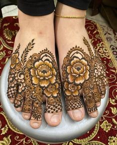 the feet are decorated with henna and flowers