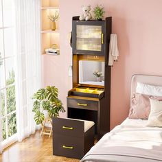 a bedroom with a bed, dresser and window in the corner next to pink walls