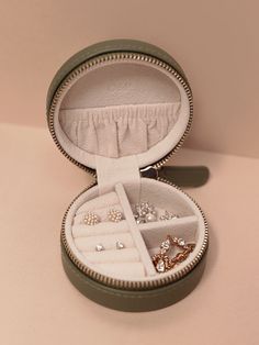 DESCRIPTION This beautiful compact jewelry case is made for you - you on-the-go, you juggling appointments, you jet-setting, and you always being prepared. Keep your dainty gems and treasures smartly organized, tangle-free, and easily accessible. Use it to keep your jewelry safe while travelling in your suitcase or in Halo Bracelet, Travel Cases, Being Prepared, Layering Necklaces, Simple Stud Earrings, Luxe Jewelry, Wedding Jewellery Collection, Jewelry Safe, Travel Jewelry Case