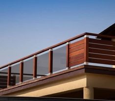 a balcony with wooden railings and glass balconies