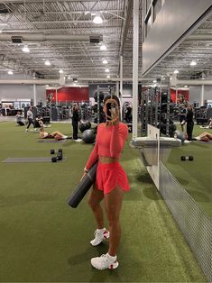 a woman taking a selfie in the gym