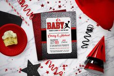 a baby shower party with red and black decorations