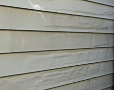 the side of a house with white siding