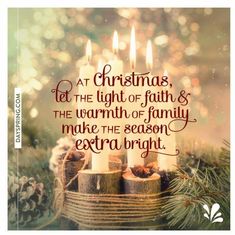 a christmas card with candles and pine cones