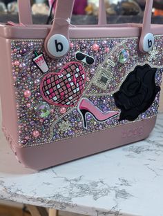 Standout of the crowd with a Blingged out Bag! Each bag is custom designed with what you love! You can request any special details you like such as initials, names and fun hobbies. Bogg Bag, Custom Bling, Brooch Diy, Fun Hobbies, Must Have Items, Custom Bags, Bling Bling, Hobbies, Initials