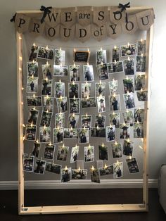 a photo collage with pictures and lights is displayed on the wall in front of a window