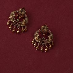 Description: Inspired by the beauty of nature, Bhagya Chandbali earrings are a symphony of Indian motifs- from flower to the Iconic Indian bird peacock. Studded with Kempu stone, this gold-plated silver earring is a testament to the skill of our master artisans. This timeless chandbali earrings are finished with an array of gold plated loop drops- perfect for a modern and ethnic look. Product Information : Materials used: 925 Silver with Antique Plating Stones: Semi-precious stones Length: 4cm F Elegant Oxidized Finish Chandbalis For Festive Occasions, Elegant Oxidized Chandbalis For Diwali, Elegant Oxidized Chandbalis For Festivals, Elegant Oxidized Chandbalis For Festive Occasions, Traditional Wedding Jewelry With Artistic Design, Chandbali Jewelry With Peacock Design For Rituals, Chandbali Peacock Design Jewelry For Rituals, Elegant Oxidized Chandbalis As Gift, Elegant Chandbalis With Oxidized Finish As Gift