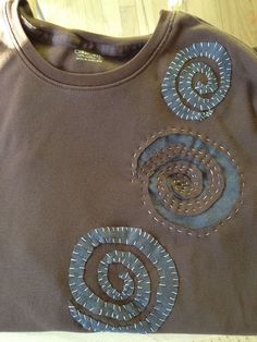 a brown shirt with blue circles on it