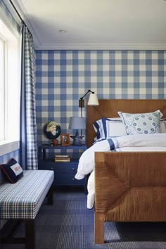 a bedroom with blue and white checkered walls