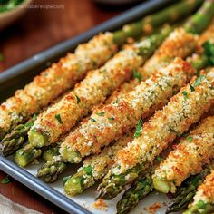 asparagus spears with parmesan cheese on top are ready to be served