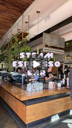 a man standing in front of a wooden counter with food on it and the words steam espresso above him