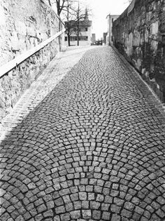 an old cobblestone street in black and white