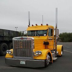 a large yellow truck parked in a parking lot