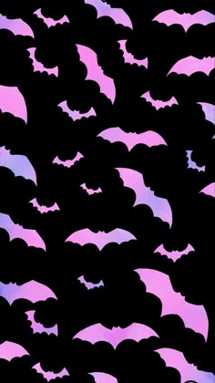 a flock of bats flying through the night sky