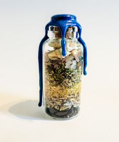 a jar filled with lots of different types of things