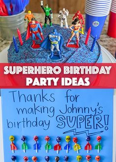 a birthday cake with the words superhero birthday party ideas written on it and some decorations