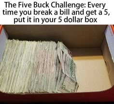 a box filled with money sitting on top of a table