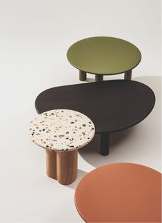 an assortment of tables and stools in various colors