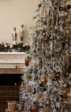 a decorated christmas tree with gold and silver ornaments