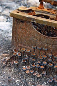 an old typewriter sitting on the ground