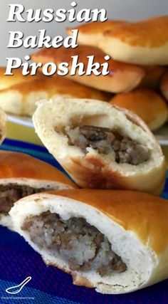 russian baked pita breads with meat in them on a blue and white plate