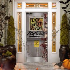 an open door with graffiti on it in front of some plants and pumpkins,