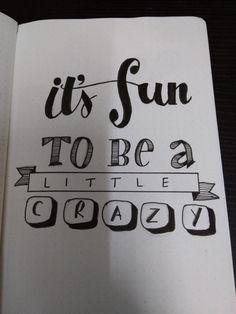 an open notebook with the words it's fun to be a little crazy