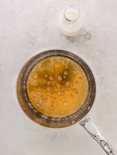 a pan filled with liquid sitting on top of a counter