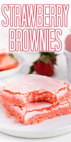 strawberry brownies on a white plate with strawberries in the background and text overlay